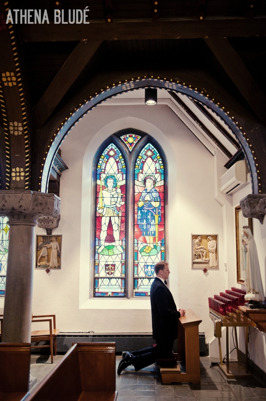 Groom praying at Mass West Point Wedding